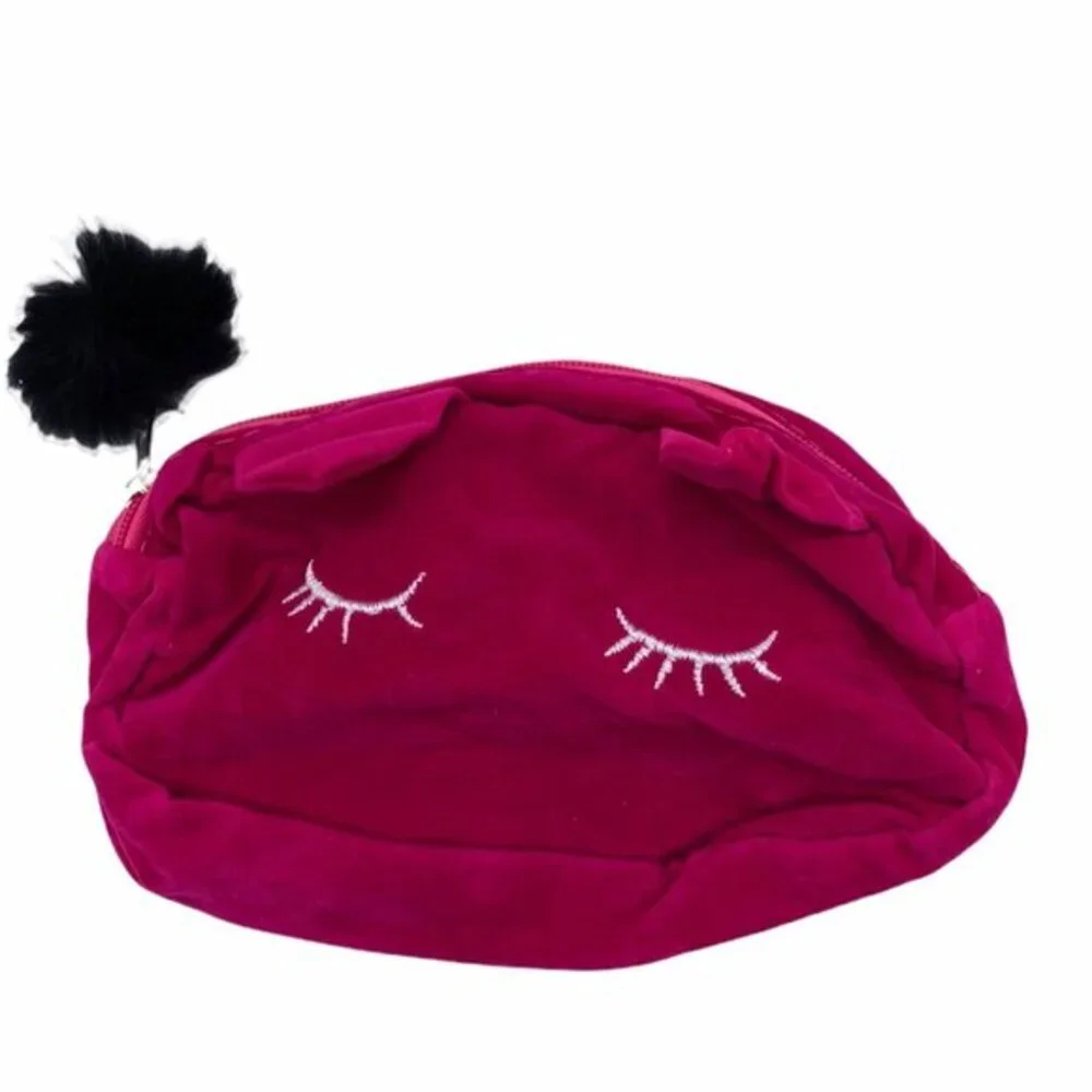 Pink Velvet Cosmetic Pouch With Embroidered Eyelash‎ Design & Fluffy Pom Pom